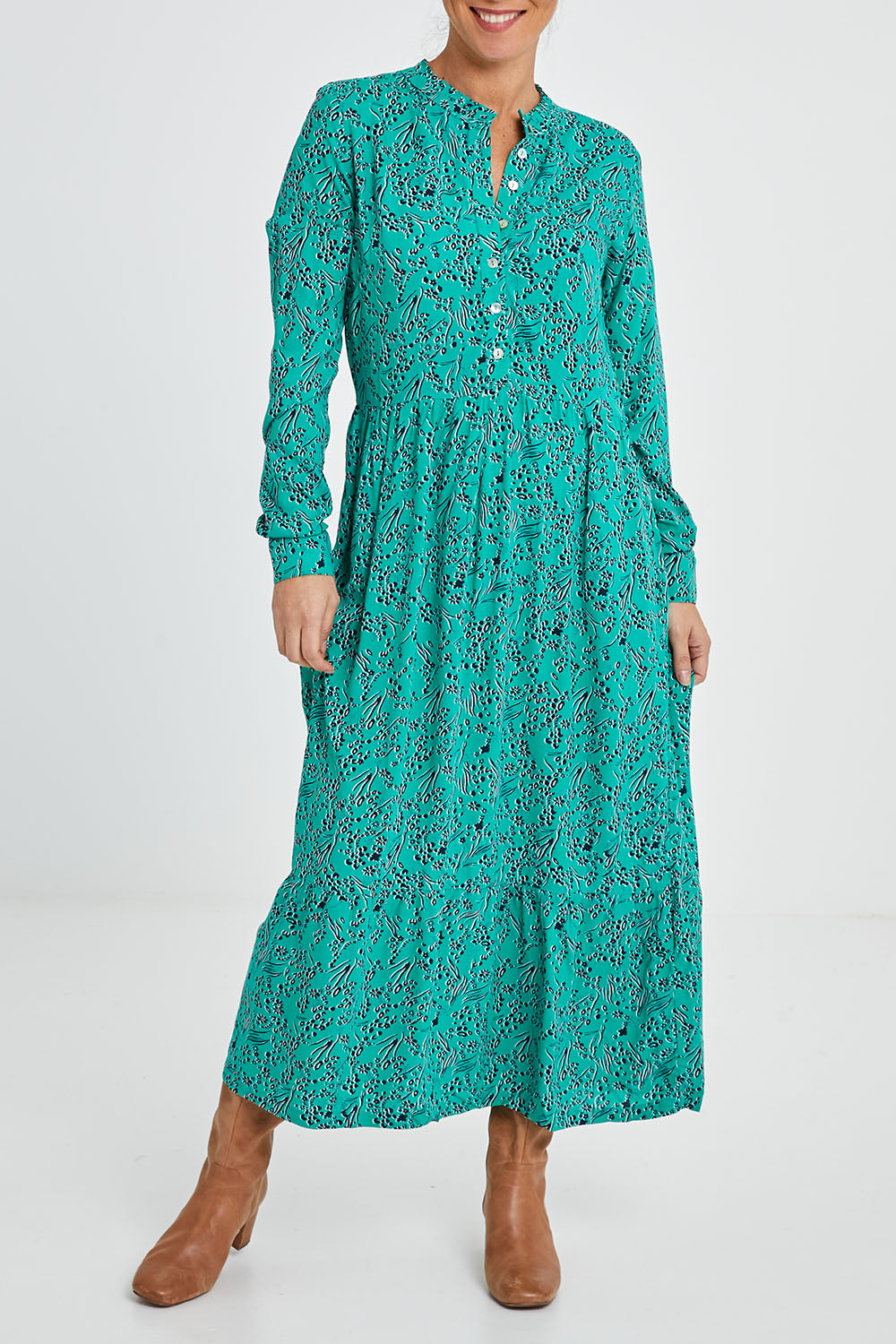 Model Katie wearing size 10 of the Valley Dress in colour Green (Green), from the front, cropped image