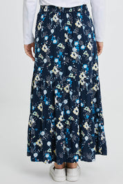 Model Katie wearing size 10 of the Frome Skirt in colour Navy (Blue), from the back