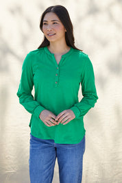 A model wearing the Peony Top in colour Bgreen (Green), from the front, showing the whole outfit