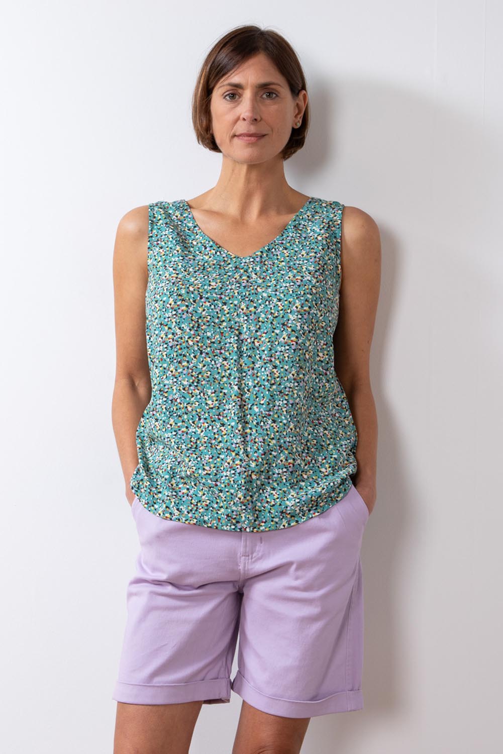 A model wearing the Marine Twill Short in colour Lavender (Purple), from the front, cropped image
