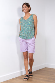 A model wearing the Marine Twill Short in colour Lavender (Purple), from the front, showing the whole outfit