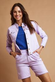Model Madeline wearing size 10 of the Marine Twill Short in colour Lavender (Purple), from the front, showing the whole outfit