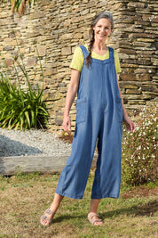 A model wearing the Edith Jumpsuit in colour Tencel (Blue), from the front, showing the whole outfit