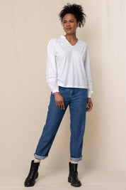 A model wearing the Bette Cotton Top in colour White (White), from the front, showing the whole outfit