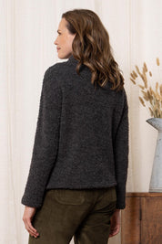 A model wearing the May Wool Blend Jumper in colour Charcoal (Black), from the back