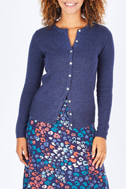 Model Summer wearing size 10 of the Vintage Knit Cardigan in colour NavyMarl (Blue), from the front, cropped image