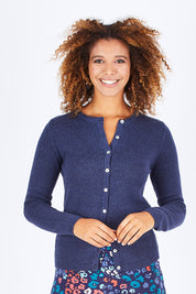 Model Summer wearing size 10 of the Vintage Knit Cardigan in colour NavyMarl (Blue), from the front, cropped image