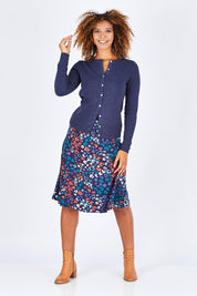 Model Summer wearing size 10 of the Vintage Knit Cardigan in colour NavyMarl (Blue), from the front, showing the whole outfit