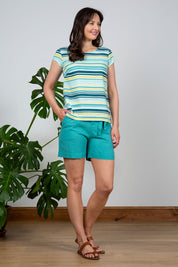 A model wearing the Sun And Shade Top in colour Tealstrip (Green), from the front, showing the whole outfit