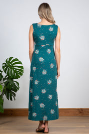 A model wearing the Chrissy Maxi Dress in colour Darkteal (Green), from the back