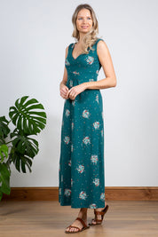 A model wearing the Chrissy Maxi Dress in colour Darkteal (Green), from the front, showing the whole outfit
