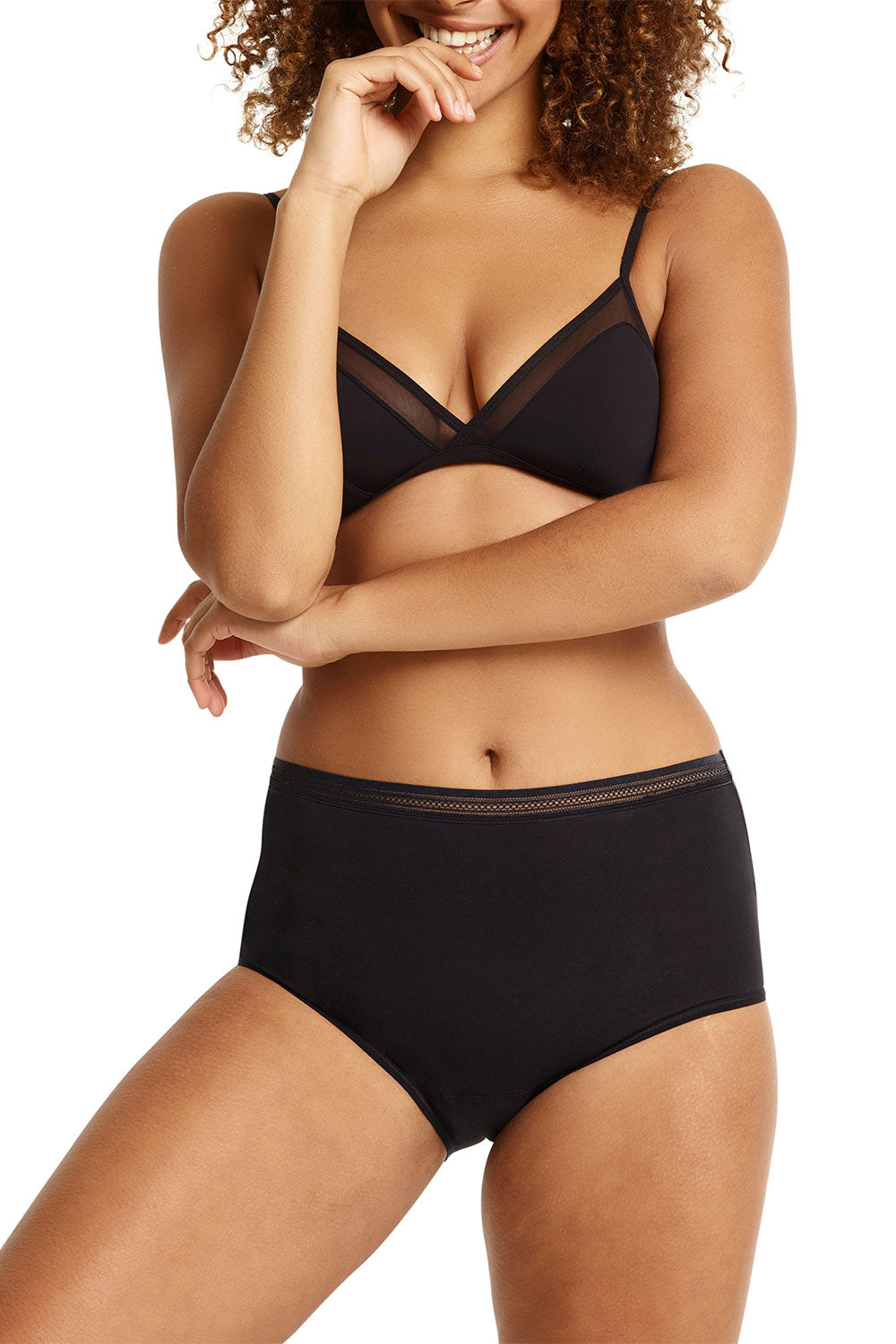 A model wearing the Luna Leaks Full Brief in colour Black (Black), from the front, cropped image