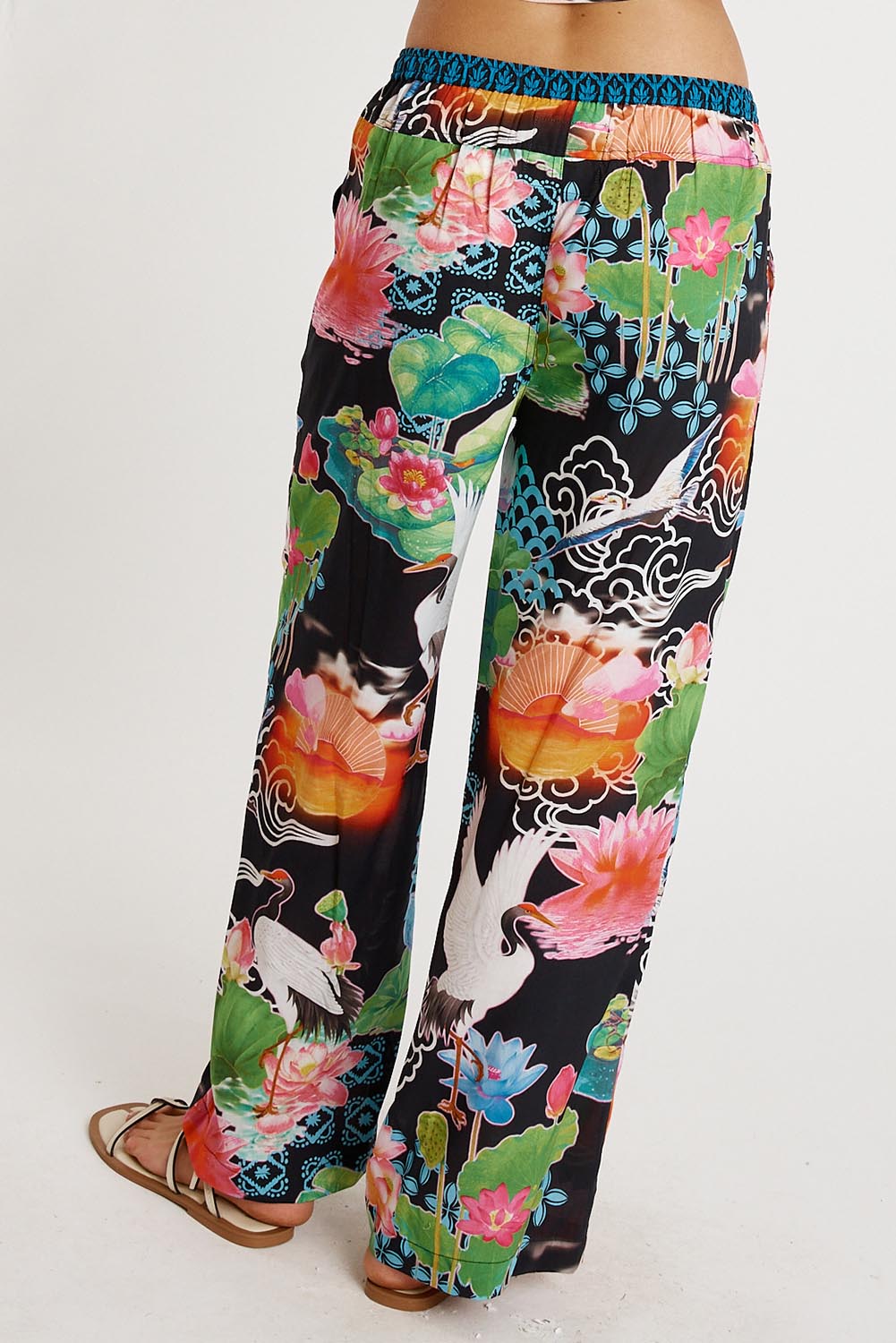 A model wearing the Akiko Pant in colour Ocean, from the back