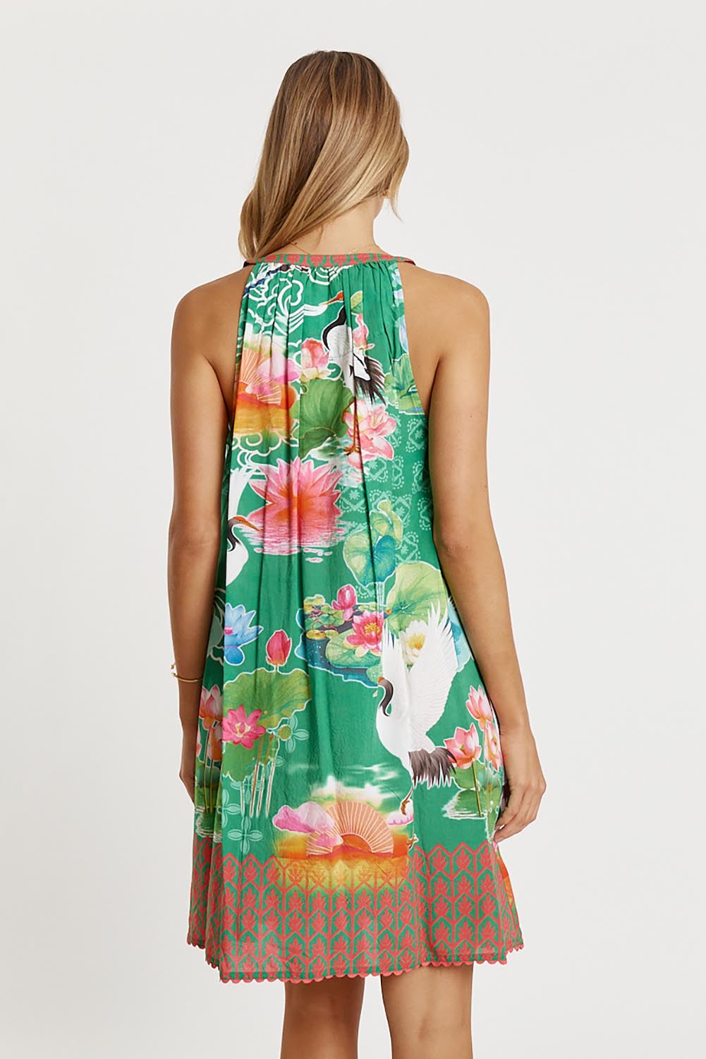 A model wearing the Akiko Sundress in colour Sea (Green), from the back