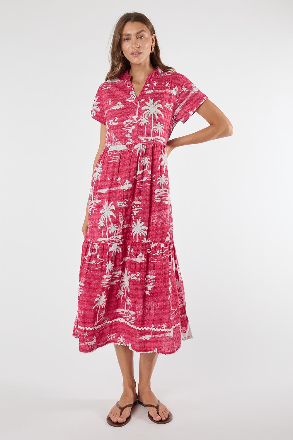 Model Genericm wearing size sample of the Alura Midi Dress – Melon in colour Melon, from the front