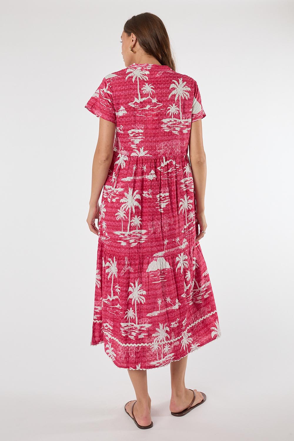 Model Genericm wearing size sample of the Alura Midi Dress – Melon in colour Melon, from the front