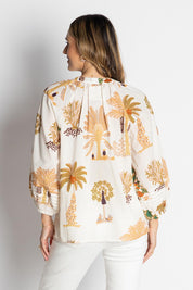A model wearing the Amrita Cotton Shirt in colour White (White), from the back