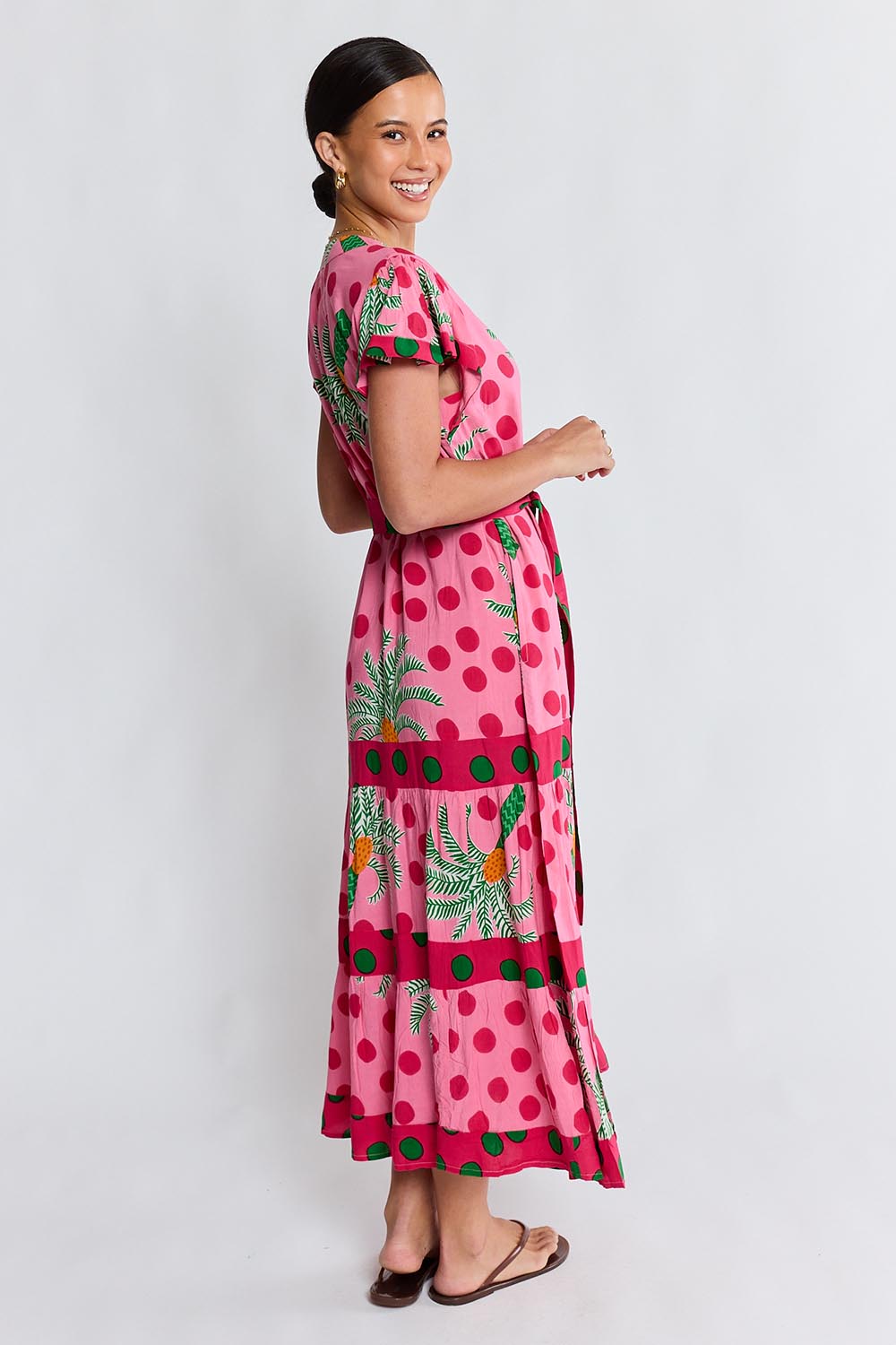 Model Genericm wearing size sample of the Blanch Midi Dress – Melon in colour Melon, from the front