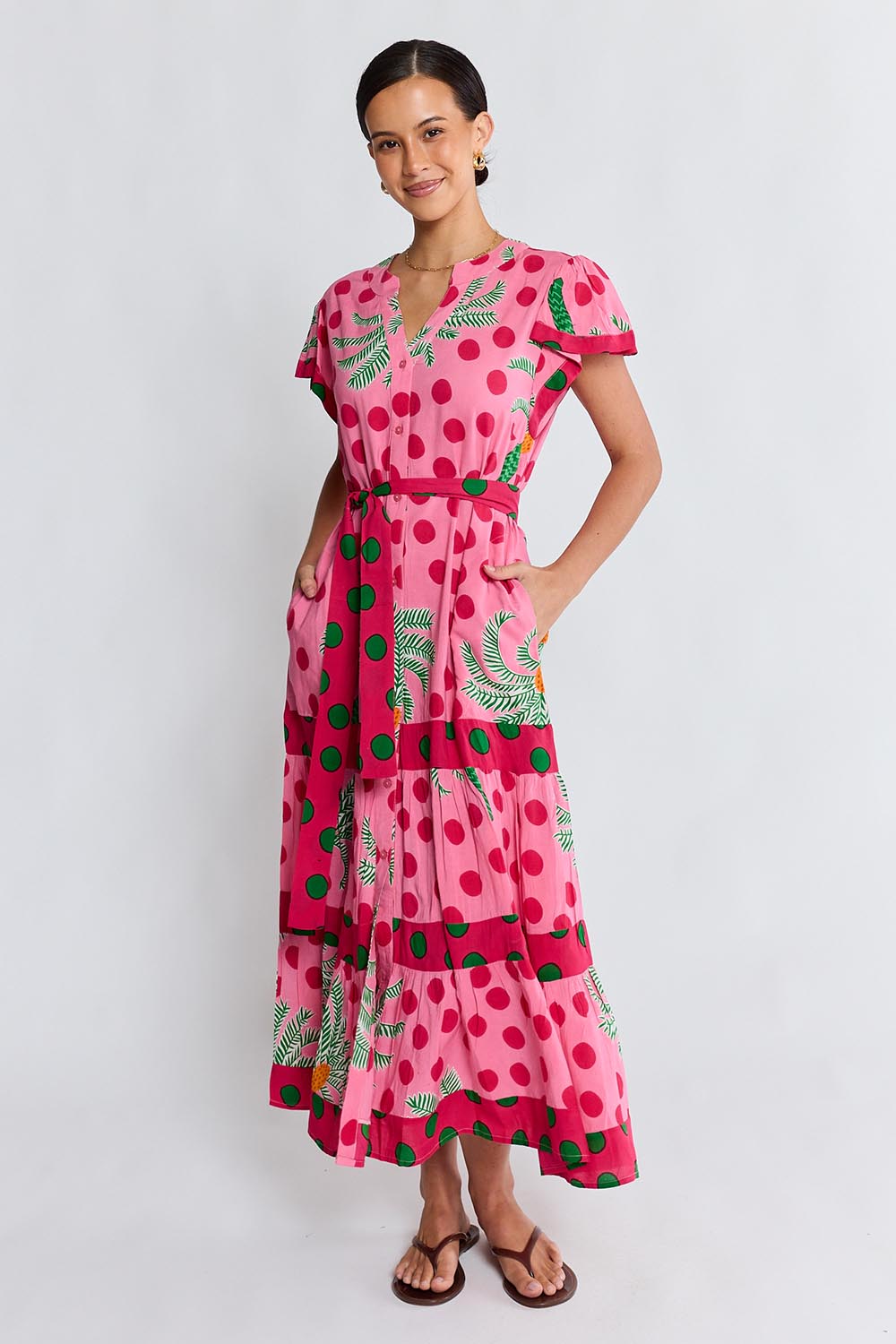 Model Genericm wearing size sample of the Blanch Midi Dress – Melon in colour Melon, from the front