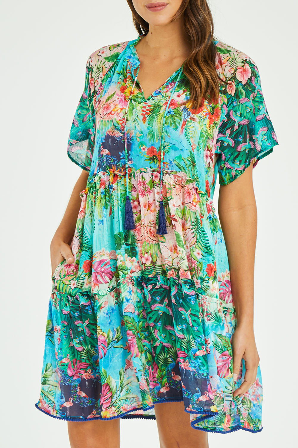 Model Madeline wearing size S of the Bonnie Dress in colour Print (Blue), from the front, cropped image