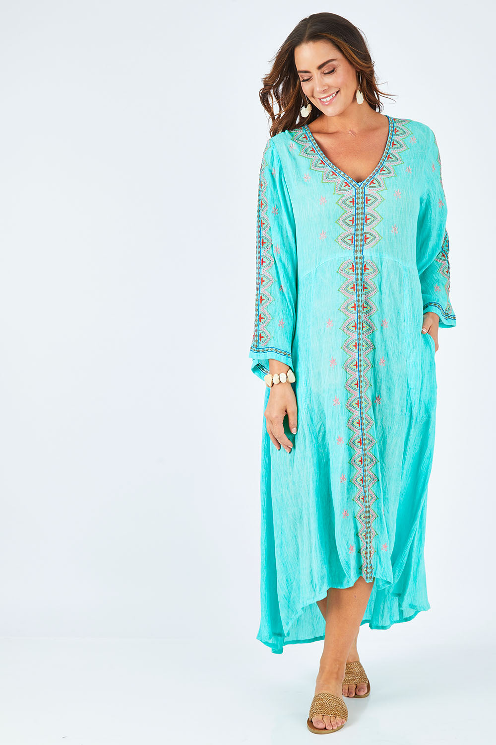 Model Abby wearing size L of the Brazil Dress in colour Aqua (Blue), from the front, showing the whole outfit