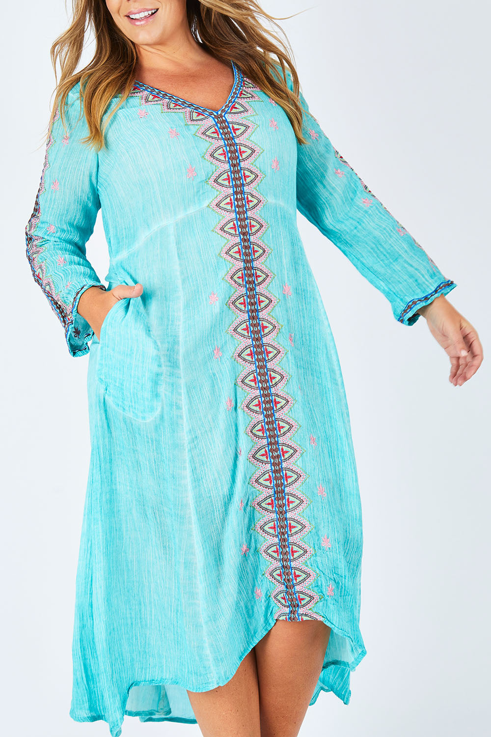Model Fiona wearing size XL of the Brazil Dress in colour Aqua (Blue), from the front, cropped image