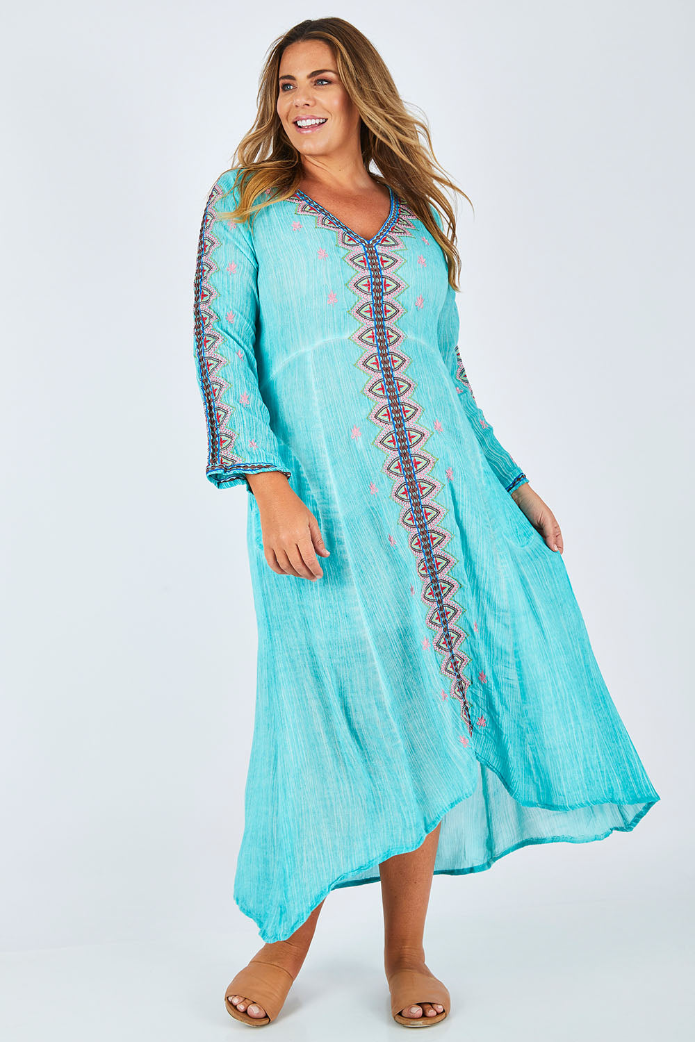 Model Fiona wearing size XL of the Brazil Dress in colour Aqua (Blue), from the front, showing the whole outfit