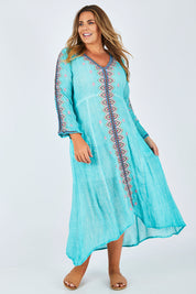 Model Fiona wearing size XL of the Brazil Dress in colour Aqua (Blue), from the front, showing the whole outfit