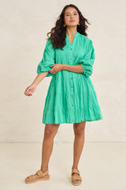 Model Tahnee wearing size S of the Celeste Cotton Dress in colour Sea (Green), from the front, showing the whole outfit