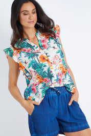 Model Gemma wearing size S of the Coconut Short in colour Indigo (Blue), from the front, cropped image