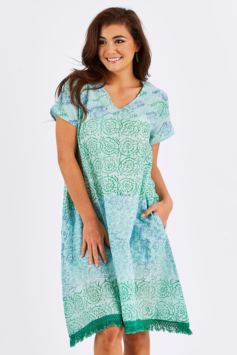 Model Chesska wearing size S of the Delphi Dress in colour Sea (Green), from the front, cropped image
