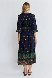 Model Genericm wearing size sample of the Emma Midi Dress – Ebony in colour Ebony, from the front