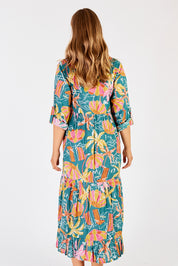 A model wearing the Harlow Midi Dress in colour Sea (Green), from the back