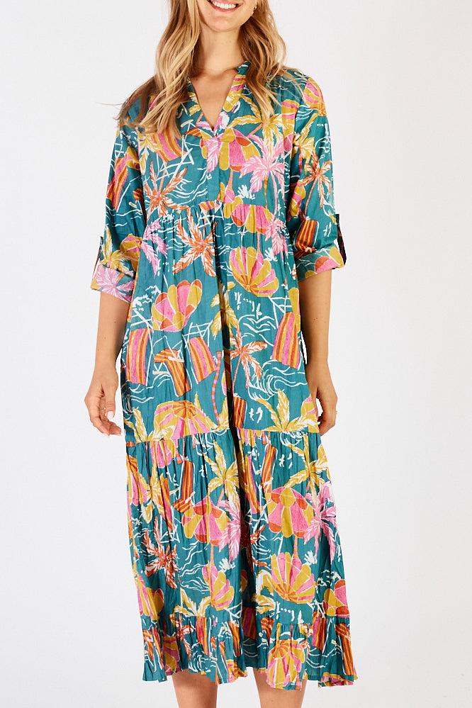 A model wearing the Harlow Midi Dress in colour Sea (Green), from the front, cropped image