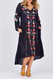 Model Jess wearing size L of the Hayman Dress in colour Navy (Blue), from the front, cropped image
