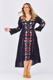 Model Jess wearing size L of the Hayman Dress in colour Navy (Blue), from the front, showing the whole outfit