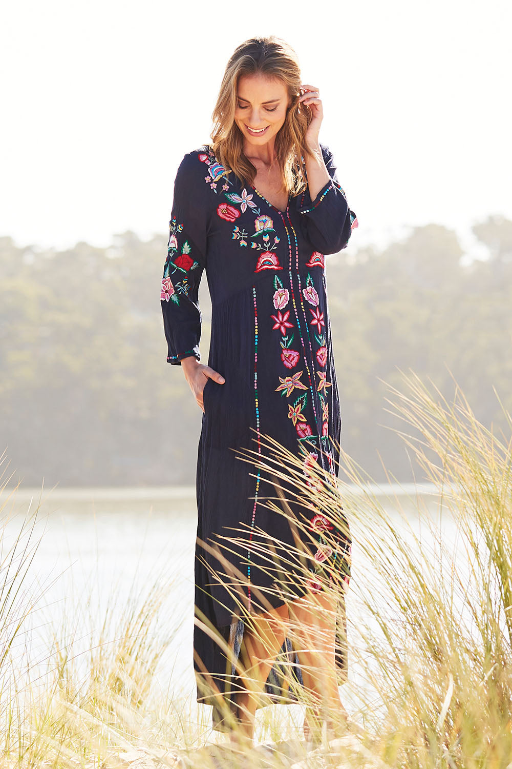 Model Riina wearing size S of the Hayman Dress in colour Navy (Blue), from the front, showing the whole outfit