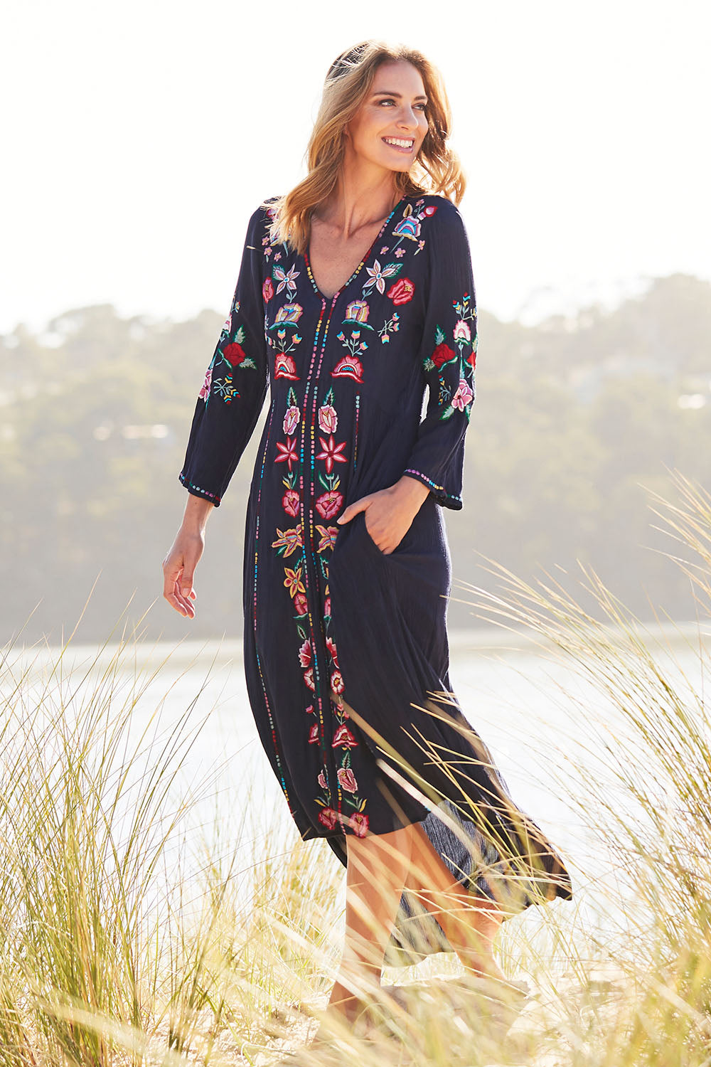Model Riina wearing size S of the Hayman Dress in colour Navy (Blue), from the front, showing the whole outfit