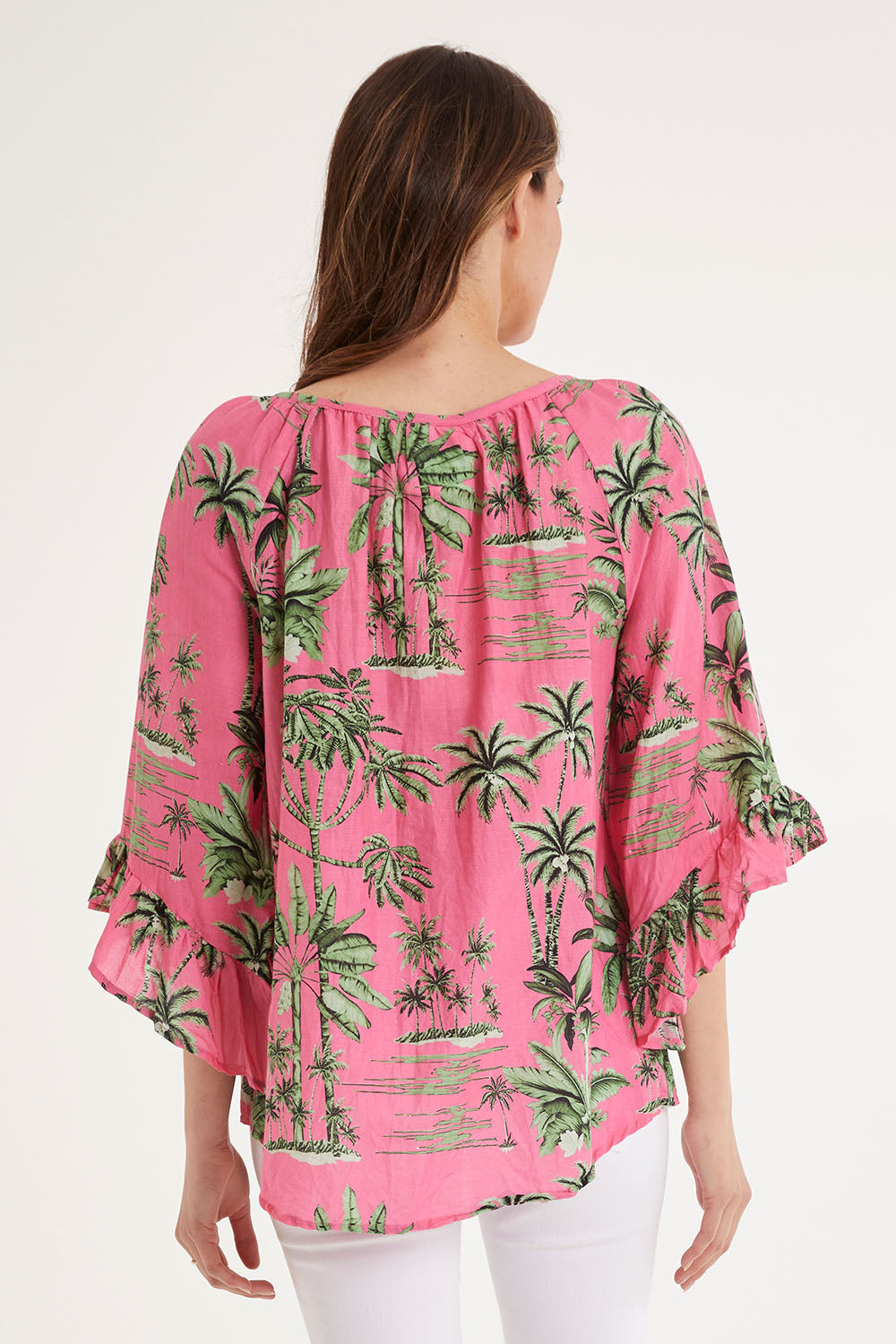 Model Madeline wearing size S of the Island Girl Top in colour Musk (Pink), from the back