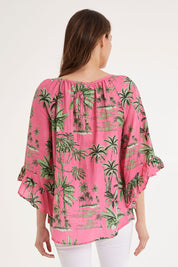 Model Madeline wearing size S of the Island Girl Top in colour Musk (Pink), from the back