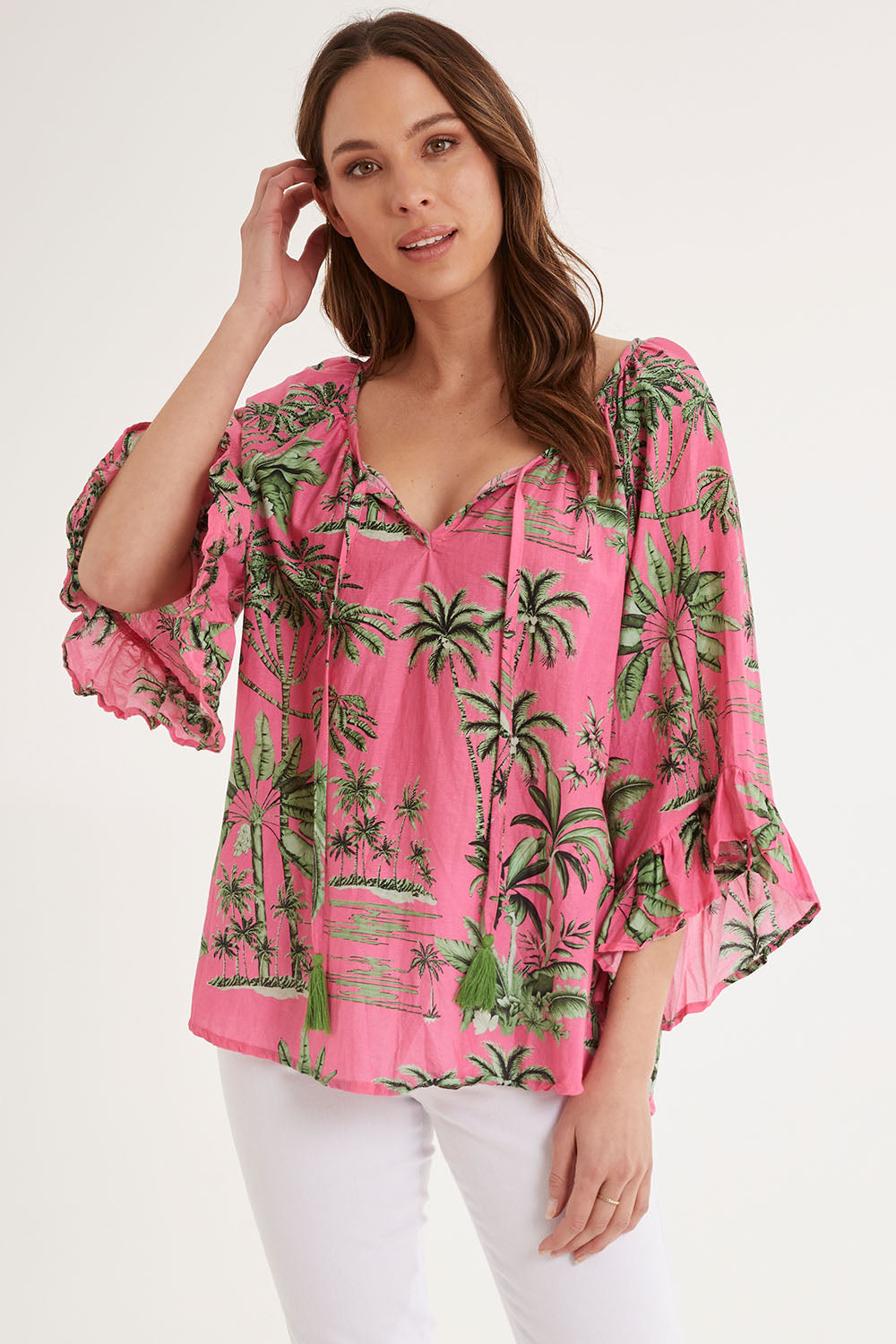 Model Madeline wearing size S of the Island Girl Top in colour Musk (Pink), from the front, cropped image