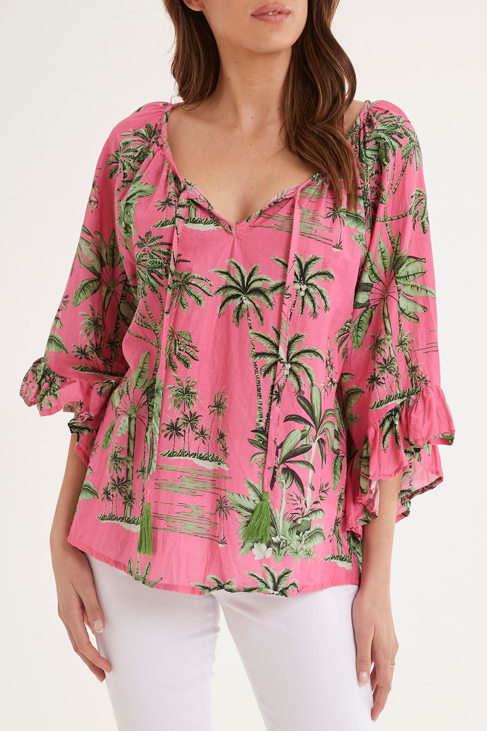 Model Madeline wearing size S of the Island Girl Top in colour Musk (Pink), from the front, cropped image