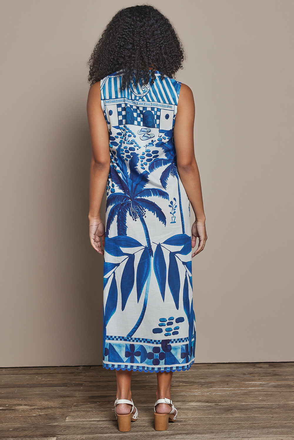 Model Ziara wearing size S of the Karasi Cotton Dress in colour White (Blue), from the back