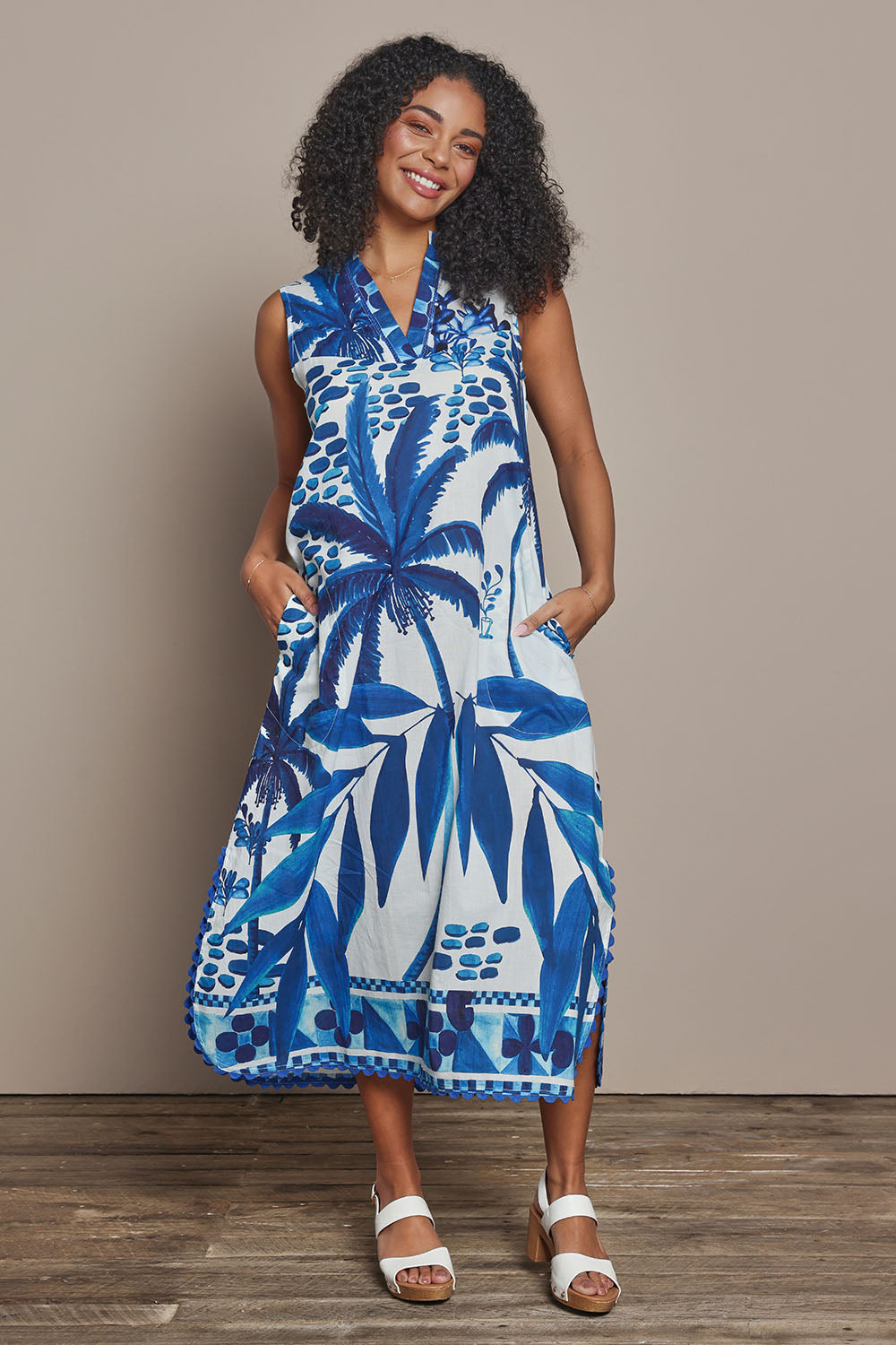 Model Ziara wearing size S of the Karasi Cotton Dress in colour White (Blue), from the front, showing the whole outfit