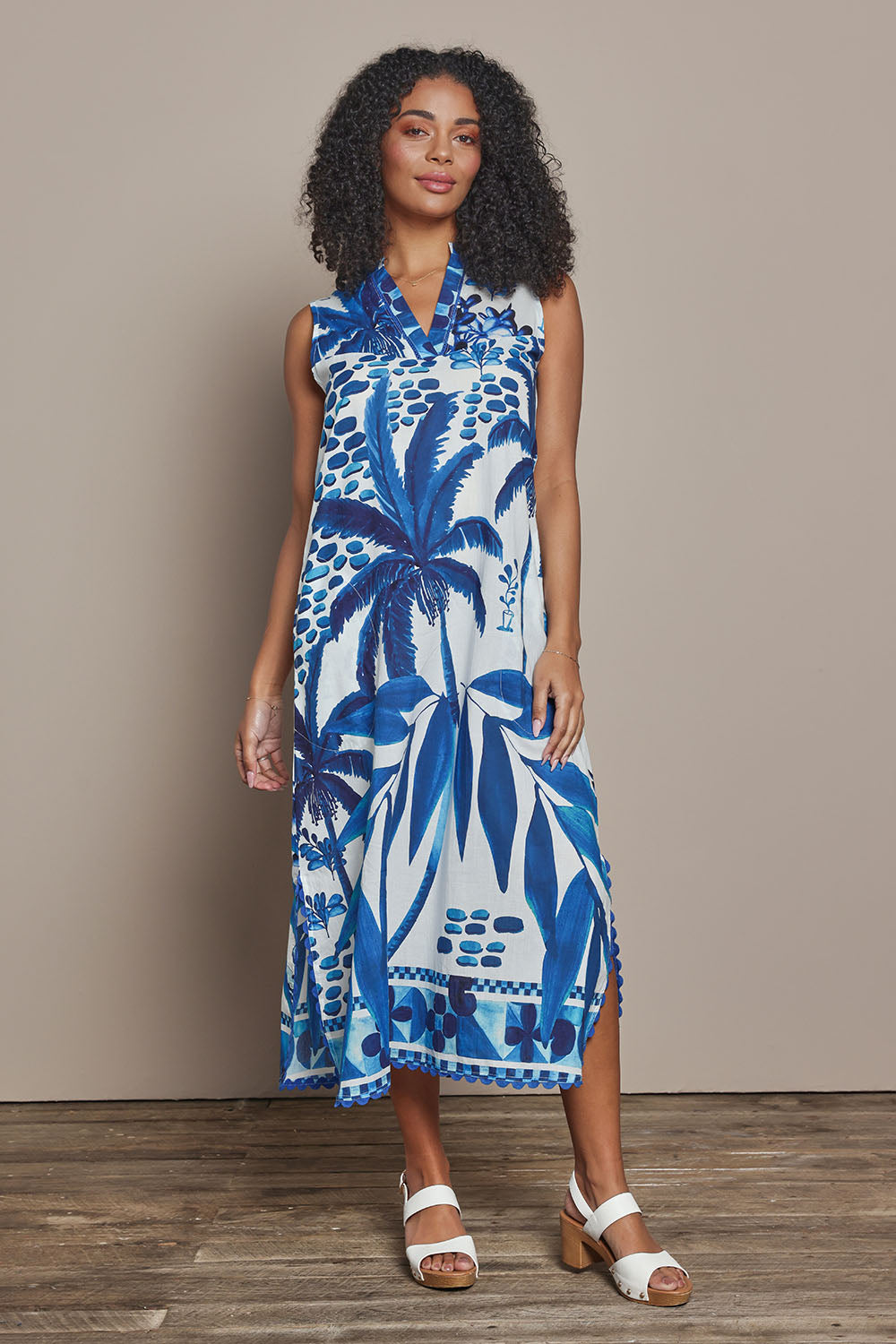 Model Ziara wearing size S of the Karasi Cotton Dress in colour White (Blue), from the front, showing the whole outfit