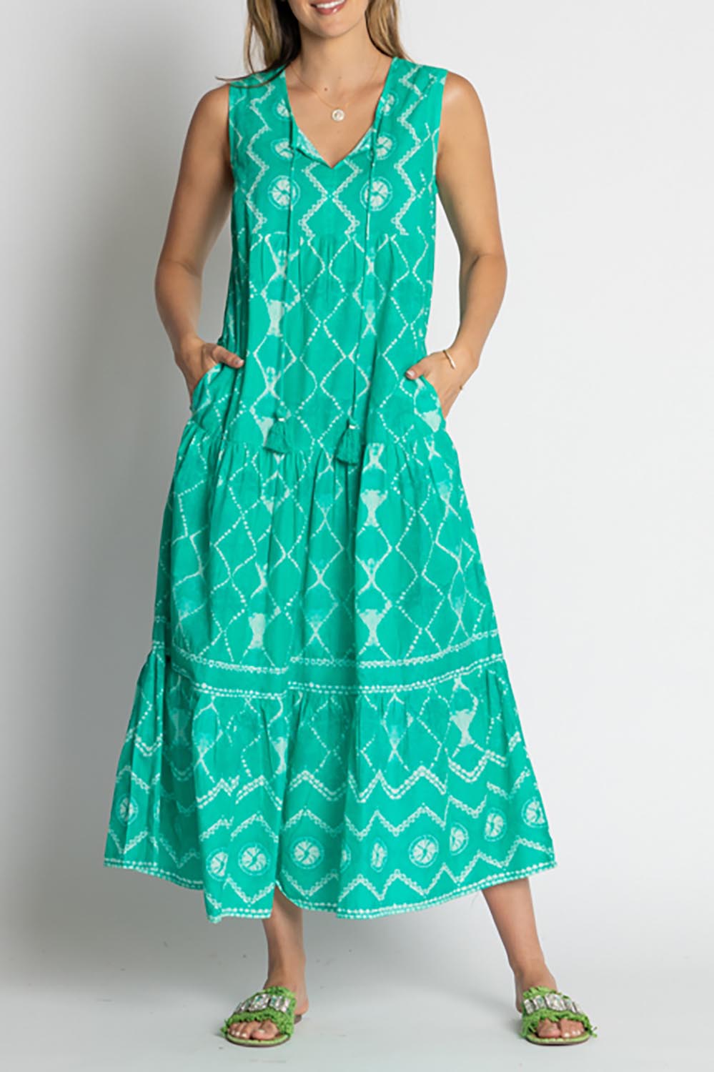 A model wearing the Kumo Cotton Maxi Dress in colour Sea (Green), from the front, cropped image
