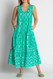 A model wearing the Kumo Cotton Maxi Dress in colour Sea (Green), from the front, cropped image