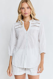 Model Genericm wearing size sample of the Laverne Tuck Shirt – White in colour White, in a cropped view