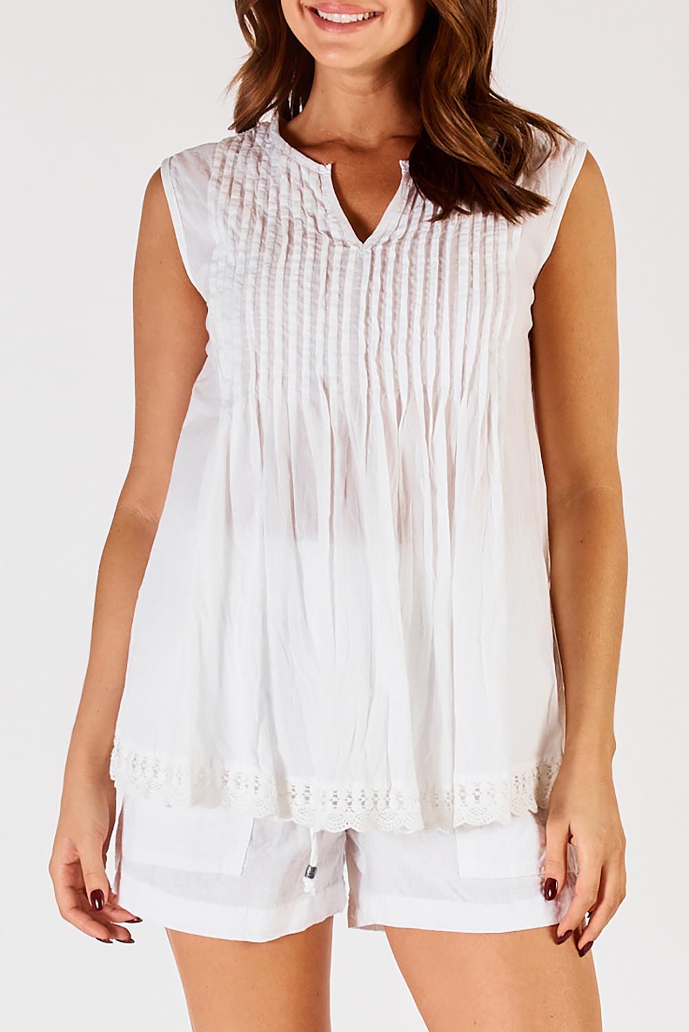 A model wearing the Leila Cotton Tank in colour White (White), from the front, cropped image