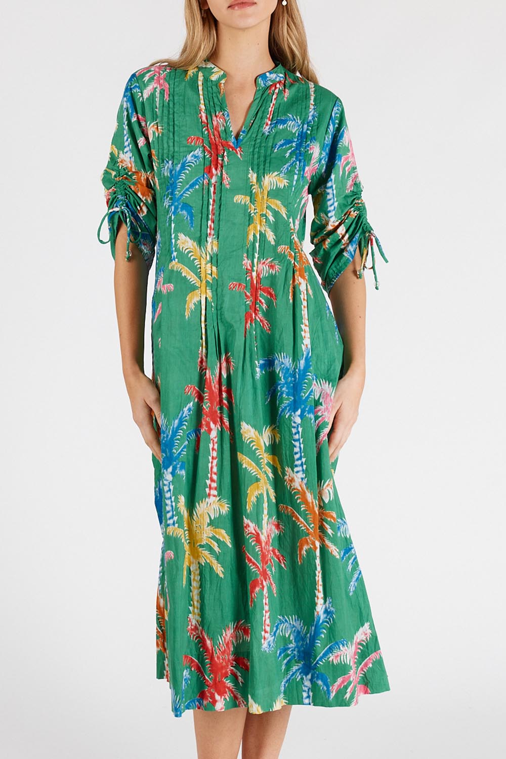 A model wearing the Leilani Cotton Midi Dress in colour Sea (Green), from the front, cropped image